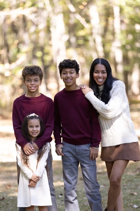 Melissa with her three children outdoors
