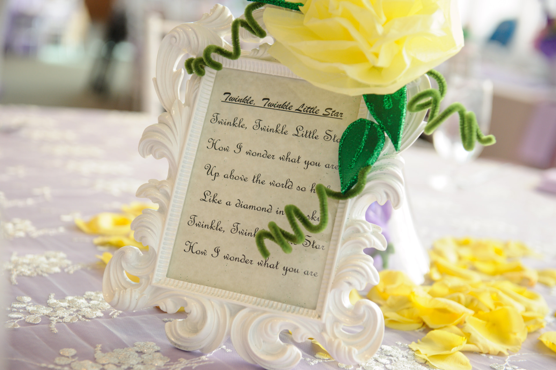Framed Twinkle, Twinkle Little Star lyrics beside a yellow paper flower